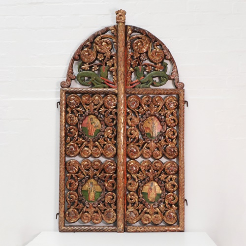 A pair of carved and pierced giltwood Royal doors square